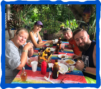 Happy customers enjoying their food at Keoki’s South Kona Grindz Ono Fish And Chips, Kailua-Kona, Hawaii